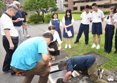 tsai hsing students watching fabco stormbasin installation on school grounds