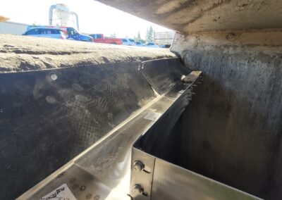 fabco industries open curb stormwater filter stormtrough trough segments along wall