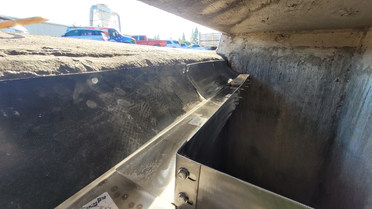 fabco industries open curb stormwater filter stormtrough trough segments along wall